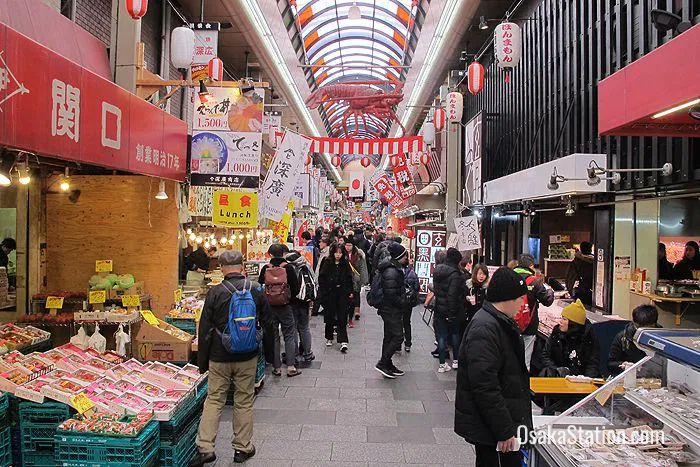 Colorful stalls at Kuromon Market with fresh food